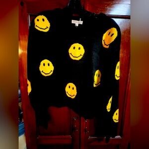 Women size medium, made by grey lab black smiley face sweater